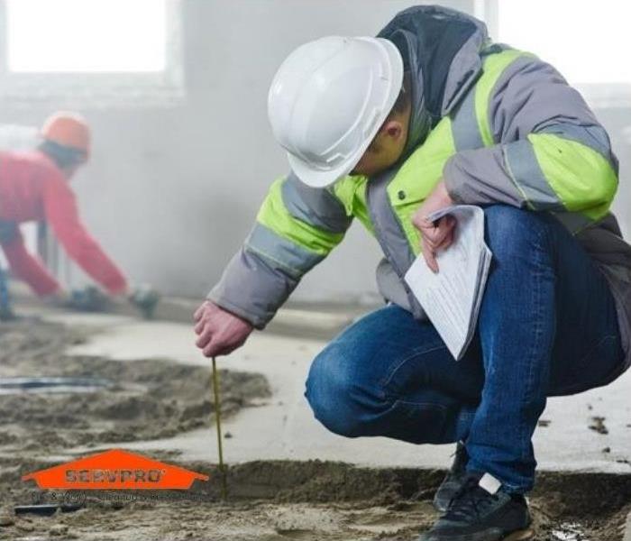 Construction worker on job site servpro logo